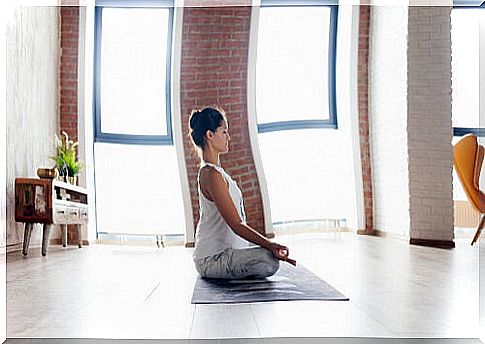 Woman meditating at home