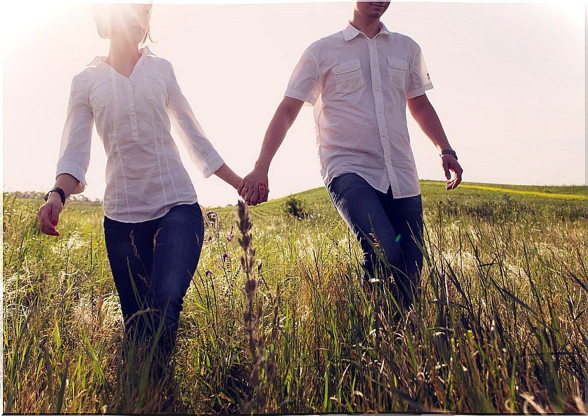 Couple holding hands