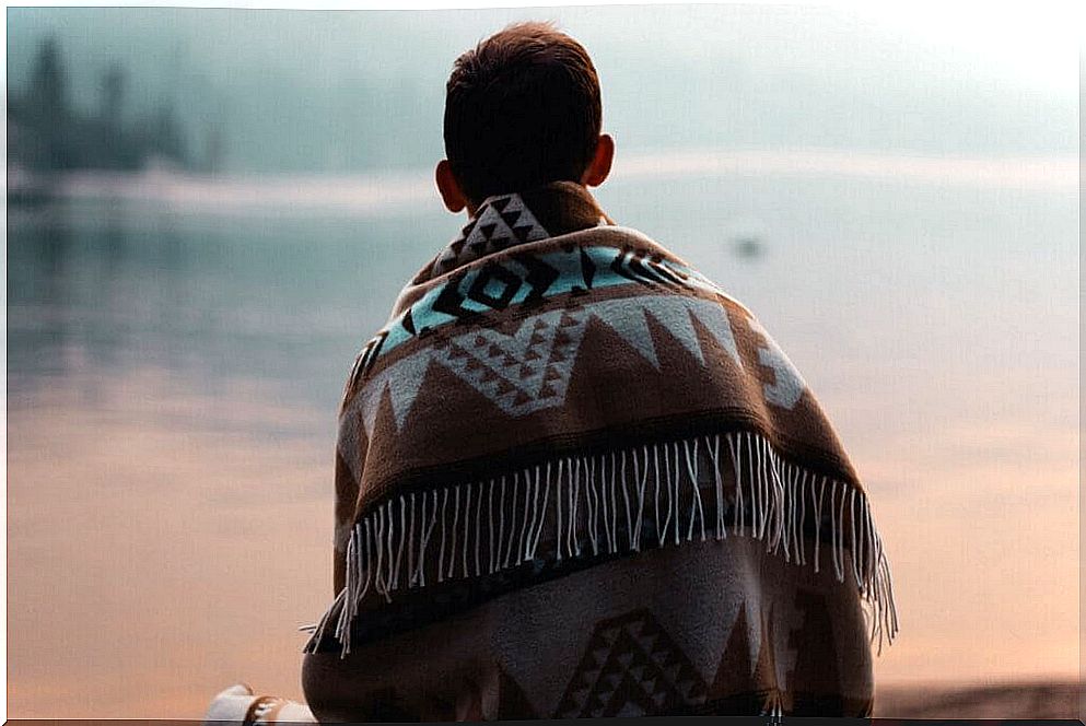 Boy from back with a blanket