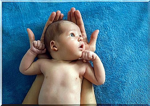 Newborn on his mother's hands