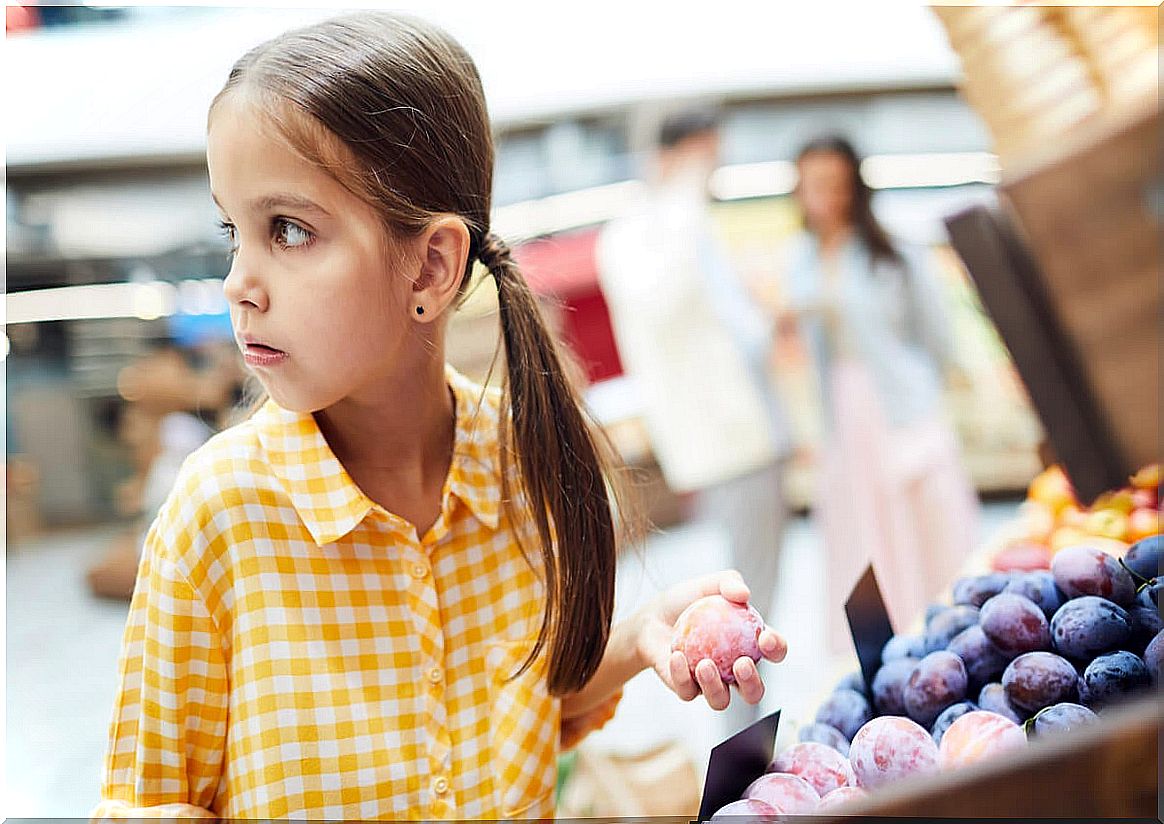 Girl stealing fruit