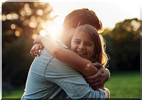 Father hugging his daughter, emotions