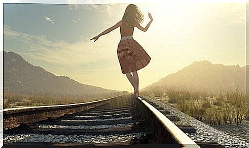 Woman walking down a track