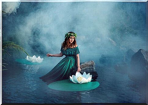 Woman among water lilies thinking about the past