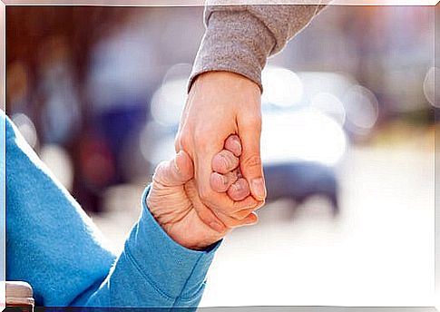 Person with a disability shaking hands with another as an example of functional diversity