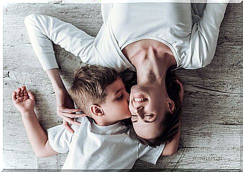 Mother kissing her son