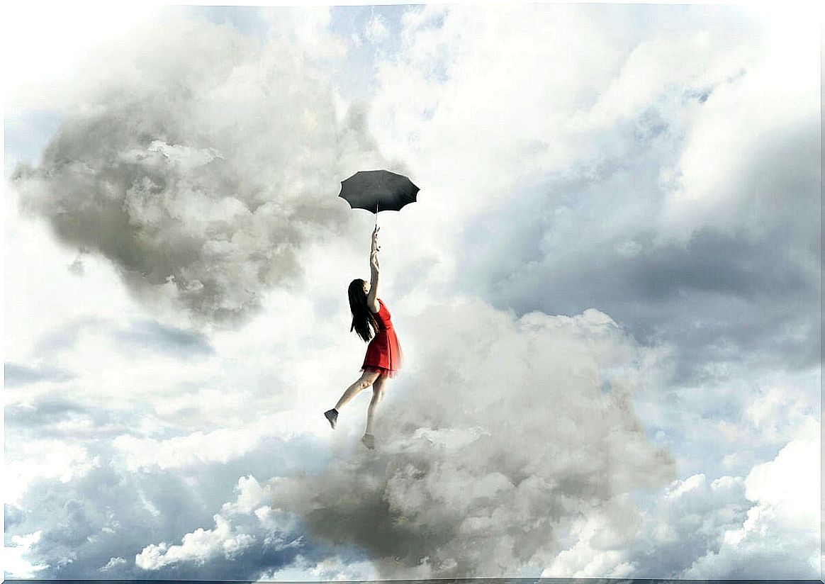 Woman flying with an umbrella between clouds thinking that there are no limits