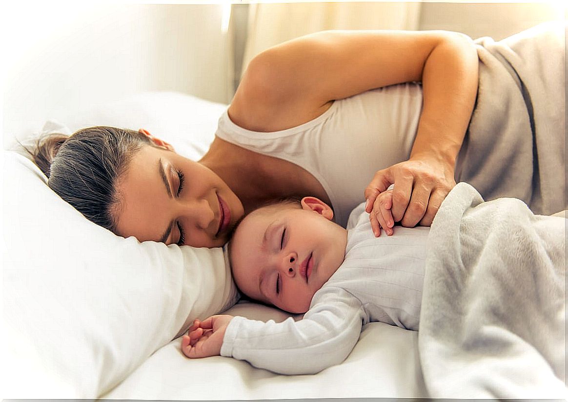 Mother and baby in bed