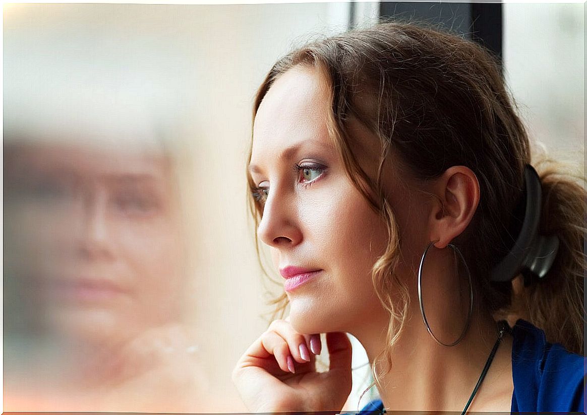 Woman thinking looking out the window