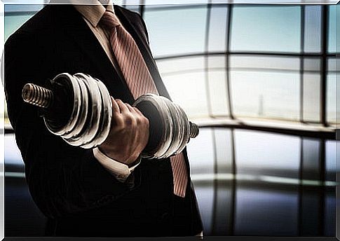 Worker with a dumbbell to represent resilience at work