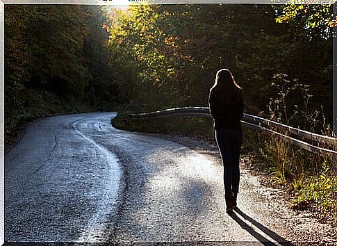 Woman walking down a path