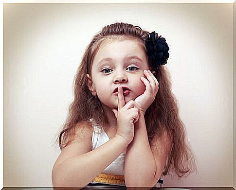 Little girl putting her finger in her mouth