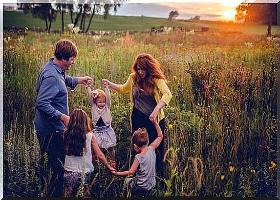 Family playing in the field