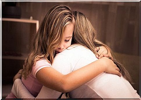 Little girl hugging her mother