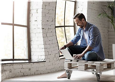 Man with a computer at home