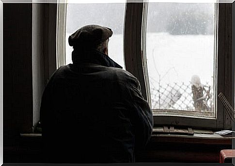 Man with Alzheimer's looking out the window