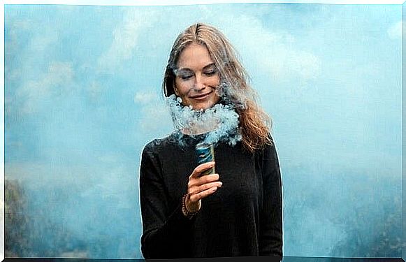 woman surrounded by smoke facing anger