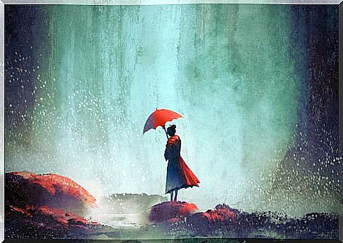 Lonely woman with a red umbrella thinking that I feel lonely